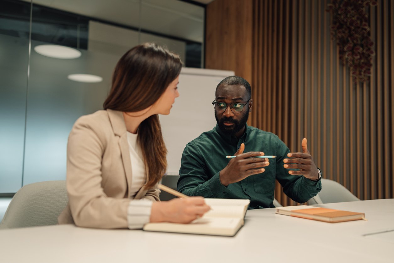 Business-partners-discussing-during-a-meeting-in-the-office-2211814984_1258x838 (1)