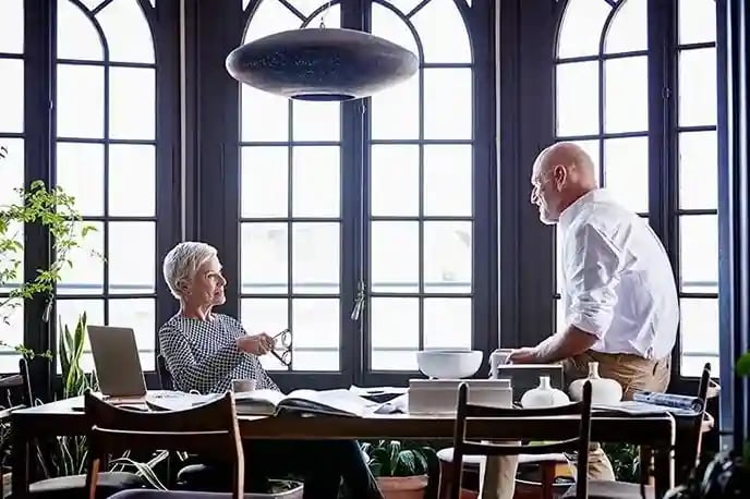 generational-coworkers-at-conference-table-min (1)_11zon