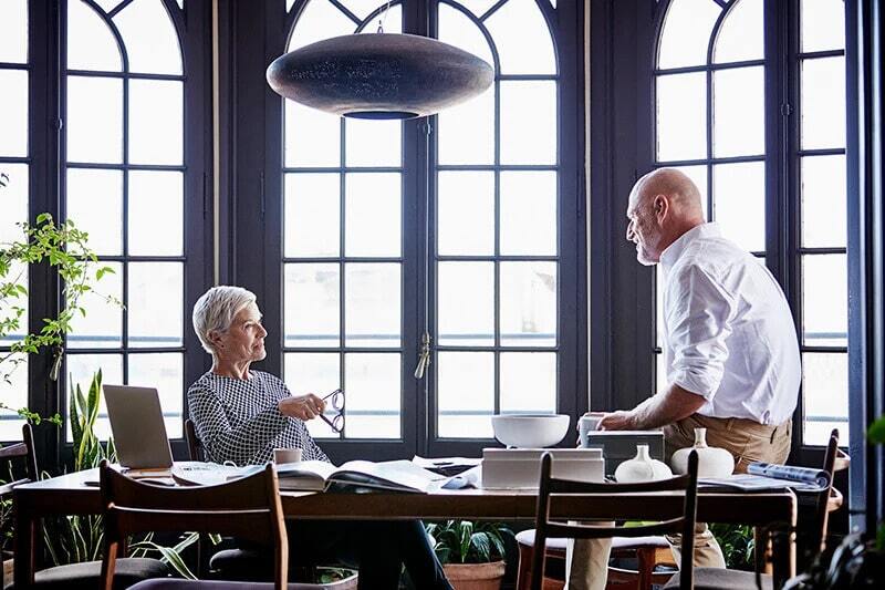 generational-coworkers-at-conference-table-min