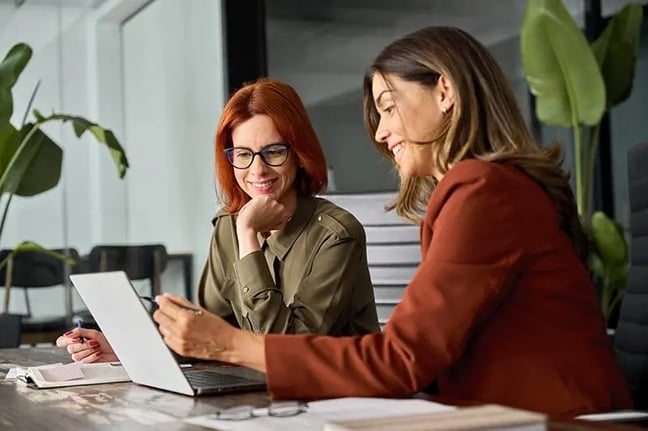 two-women-at-conference-table-1